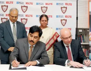  ?? Photo by Juidin Bernarrd ?? sunil Umrao singh and Nick godfrey signing the moU that makes the indian high school, Dubai, the first CBse school in the meNa region to become the centre for ielts. also seen are sumathi vasudev Consul Press, Community affairs and Welfare and ashok...