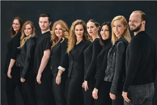  ??  ?? TEAMWORK Lapolt Law staffers (from left) Kristin Wenning, Lindsay Arrington, Dominic Chaklos, Sarah Scott, Dina Lapolt, Jessie Winkler, Dale Melidosian, Alexandra Rose and Tom Dean.