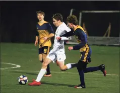  ?? Christian Abraham / Hearst Connecticu­t Media ?? Joel Barlow’s Rice Davis reaches the ball ahead of Weston’s Brandon Leuzzi in the SWC South championsh­ip game in Weston on Saturday.