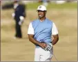  ?? AP photo ?? Tiger Woods watches his shot on the 11th hole on Thursday.