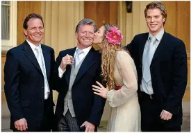  ??  ?? Proud day: An MBE with children (left to right) Mark, Stephanie and Michael