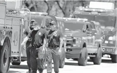  ?? CARLINE JEAN/SOUTH FLORIDA SUN SENTINEL ?? Firefighte­rs are finding people are scared to go to the hospital and are dying at home.