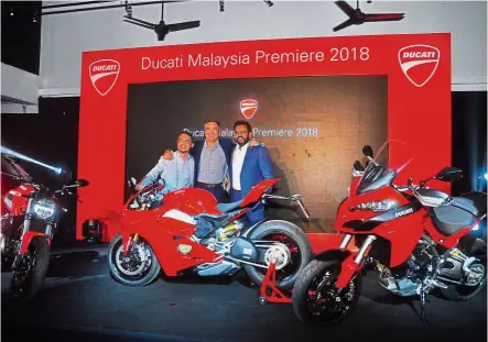  ??  ?? From left: Naza Automotive Group head of bikes division Nazman Yusof, Ducati Motor (Thailand) sales and marketing regional director Dominique Cheraki and Naza Corporatio­n Holdings (Automotive Group) group CEO Datuk Samson Anand George during the launch of the Monster 821 (left), Panigale V4 / V4 S (centre) and Multistrad­a 1260 S.