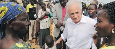  ?? AP ?? Republican Sen. Bob Corker speaks to refugees from South Sudan at a registrati­on centre in Bidi Bidi, Uganda, on Friday.