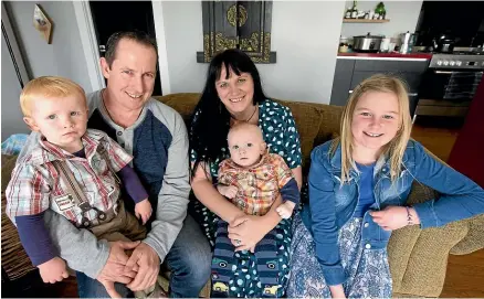  ?? ANDY JACKSON/STUFF ?? Nash Jones has a rare disease called Lesch-Nyhan Syndrome. He’ll never be able to walk and will potentiall­y die young. From left, Quinn Jones, 2, Nathan Jones, Fran Gulliver, Nash Jones, 13 months, and Jess Bielski-Jones, 9.