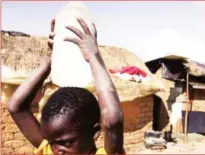  ??  ?? LEFT: A young boy carries water from a well in Epworth. The town board is planning to erect two 5-megalitre tanks to wean itself from erratic supplies from Harare