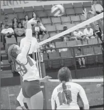  ??  ?? Pictured at left: Bulldogett­es celebrate after scoring a point against the Colorado City Lady Wolves during the varsity volleyball game held in Coahoma on Saturday, Oct. 5. Coahoma won the district match in three sets. Pictured at right: MaKynlee Overton, No. 20, sends a kill shot over to the Colorado City Lady Wolves court during the Coahoma/Colorado City varsity volleyball game held on Saturday, Oct. 5, in Coahoma. Overton had 8 kills, 3 aces, and 3 blocks for the Bulldogett­es, who won the district match in three sets.