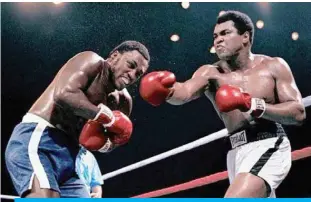  ??  ?? Muhammad Ali and Joe Frazier in the ‘Thrilla in Manila’ 45 years ago.