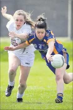  ??  ?? Kildare's Amy McGrane is beaten to the ball by Wicklow's Rose Fagan.