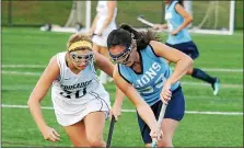  ?? GENE WALSH — MEDIANEWS GROUP FILE ?? Lower Moreland’s Taryn Mayer (right), pictured here in a Nov. 2, 2017 game against Lansdale Catholic, finished her career with the Lions as the team’s all-time leading scorer.