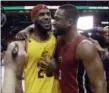  ?? ASSOCIATED PRESS FILE ?? LeBron James and Dwyane Wade are thrilled to be back together.