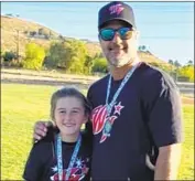  ?? Suppan family ?? FORMER major leaguer Jeff Suppan is now helping his 11-year-old daughter Finley, a softball pitcher.