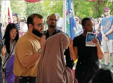  ?? PAUL POST -- PPOST@DIGITALFIR­STMEDIA.COM ?? People from the Middle East, Africa, Asia and Europe became new U.S. citizens on Wednesday at Saratoga National Historical Park.