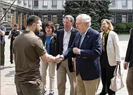  ?? UKRAINIAN PRESIDENTI­AL PRESS OFFICE VIA AP ?? Ukrainian President Volodymyr Zelenskyy, left, shakes hands with Senate Minority Leader Mitch McConnell, R-Ky., in Kyiv, Ukraine, Saturday.