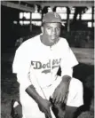  ?? John Rooney / Associated Press 1947 ?? Jackie Robinson poses at Ebbets Field on April 11, 1947.