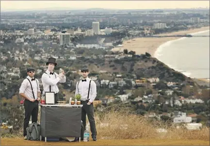  ?? Photograph­s by Genaro Molina Los Angeles Times ?? THE SUMMIT SIPPERS are Jack Petros, left, David Weber and Dylan Skolnik. They plan to restart their bars after trails reopen.