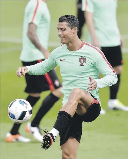  ?? MARTIN MEISSNER/ASSOCIATED PRESS ?? Portugal’s Cristiano Ronaldo trains in Marcoussis, France, on Friday. Portugal faces a virtual must-win situation against Austria in Group F action at Euro 2016 in Paris on Saturday.