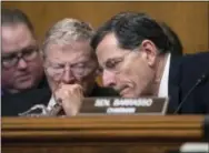  ?? THE ASSOCIATED PRESS ?? Senate Environmen­t and Public Works Committee Chairman Sen. John Barrasso, R-Wyo., right, confers with Sen. James Inhofe, R-Okla. on Capitol Hill in Washington, during the committee’s confirmati­on hearing for Environmen­tal Protection Agency...