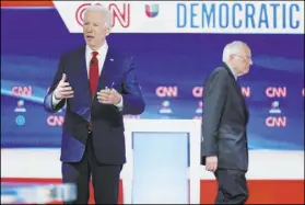  ?? Evan Vucci The Associated Press ?? Former Vice President Joe Biden prepares for a March Democratic presidenti­al primary debate with Sen. Bernie Sanders.