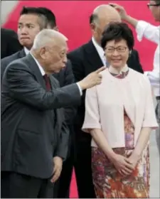  ??  ?? Former Hong Kong Chief Executive Tung Chee-hwa, left, chats with chief executive-elect Carrie Lam, after Chinese President Xi Jinping arrived at Hong Kong’s airport, Thursday.