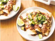  ?? Daniel J. van Ackere / Associated Press ?? Chicken Enchiladas start in a slow cooker and finish with a 15-minute trip to a hot oven.