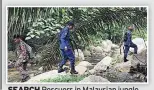  ??  ?? SEARCH Rescuers in Malaysian jungle