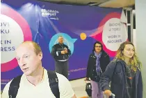  ?? PHOTO AP ?? SEE ME FLEE Vladimir (far left), a passenger from the Moscow-Belgrade flight operated by Air Serbia, speaks to the media at the airport in Serbia’s capital Belgrade on Wednesday, Sept. 21, 2022.