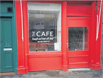  ??  ?? The Café in Main Street, Bridgend and, below, the poster in its window.