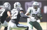  ?? Ezra Shaw / Getty Images ?? The Jets’ Matt Forte tries to get away from the Raiders’ Gareon Conley, center, and Cory James on Sept. 17.