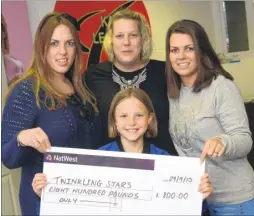  ?? Picture: Gary Browne FM4038026 ?? Ella Roper presents the cheque to sisters Georgina Varnals, Leigh Knight and Charlotte Bassett-Rogers, who set up the Twinkling Stars Project