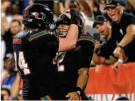  ?? MIKE EHRMANN / GETTY IMAGES ?? Center Tyler Gauthier (left) is glad he isn’t QB Malik Rosier: “I’m a big kid, so people ask you if you play football. But my face isn’t ... buzzing across ESPN all the time.”