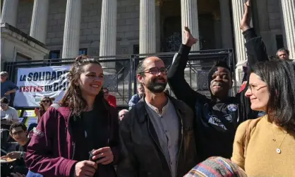  ??  ?? Supporters greet Cédric Herrou, centre, outside Lyon’s courthouse in March. Photograph: Philippe Desmazes/AFP/Getty