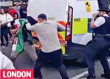  ?? ?? LONDON
Violence: Protesters waved flags as fights broke out Mayhem: Riot police wade into the crowd