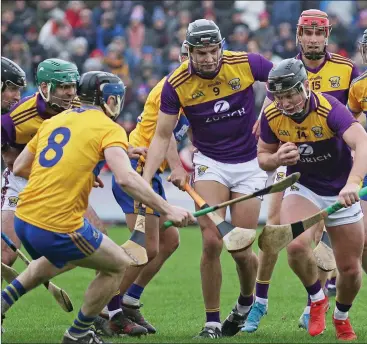  ??  ?? Conor McDonald has support from Jack O’Connor and Paul Morris as he prepares to take on Clare’s David M