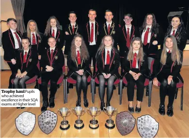  ??  ?? Trophy haul Pupils who achieved excellence in their SQA exams at Higher level their prize