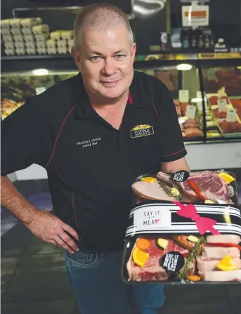  ?? MEAT AND GREET: Paul Bonner, of Sunvale Meats, with one of the meat trays which can given as a special gift. Picture: EVAN MORGAN ??