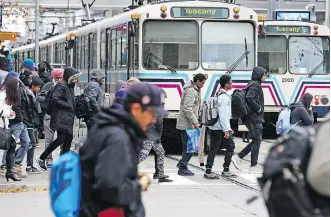  ?? GAVIN YOUNG ?? The CTrain continues to be well used by Calgarians, but the proposed Green Line LRT was the subject of much discussion at city hall on Thursday.