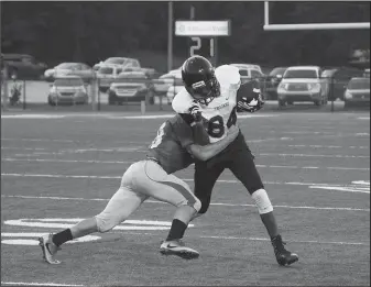  ?? The Sentinel-Record/Rebekah Hedges ?? OPEN FIELD: Hot Springs’ Tyrese Jenkins (84) battles to stay on his feet while being wrapped up by a Glen Rose defender in Tuesday night’s scrimmage in Glen Rose.