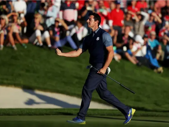  ??  ?? McIlory celebrates his match winning eagle (Getty)