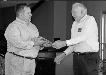  ??  ?? Rome Kiwanis Club President Keith Mickler (left) presents the Kiwanis Legion of Honor plaque to John Pillsbury for his 25 years of service to the Kiwanis Club and Rome.