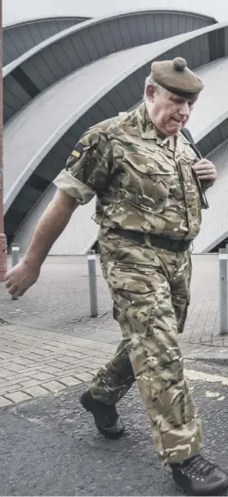  ??  ?? Soldiers outside the SEC in Glasgow which could be operationa­l as a 300-bed temporary hospital within a fortnight if it is required