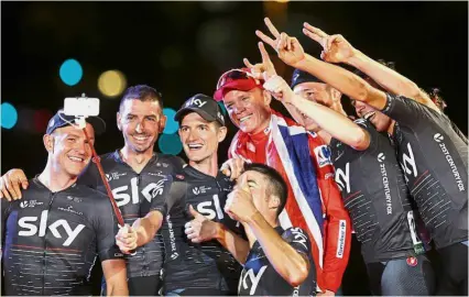  ??  ?? Sky’s the limit: Britain’s Chris Froome (centre) taking a wefie with members of his team after winning the Vuelta a Espana in Madrid on Sunday. — AP