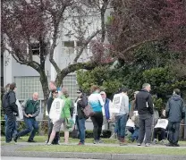  ?? DARRYL DYCK/ THE CANADIAN PRESS ?? Teachers picket at Killarney Secondary School last month. If a full strike goes ahead, some students could lose several weeks.