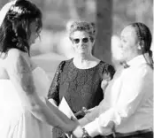  ?? LUIS SANTANA /AP ?? Klater, a Tampa wedding officiant, presides over the wedding of same-sex couple Tiffany Velazquez, left, and Yaribilisa Colon in front of Jackson’s Bistro on Harbour Island in Tampa on Jan. 21.