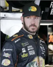  ?? TERRY RENNA — THE ASSOCIATED PRESS ?? Martin Truex Jr. stands in the garage before practice for a NASCAR Cup Series auto race at Homestead-Miami Speedway in Homestead, Fla. Truex was the fastest in the final practice of the season on Saturday afternoon and once again stamped himself as the...