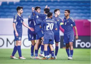  ?? ?? Kuwait players celebrate after their win over Malaysia in the Group D match at the Al Janoub Stadium in Al Wakra yesterday.