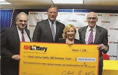  ?? PHOTO COURTESY OF N.H. LOTTERY ?? SHOW ME THE $$: Lawyers William Shaheen, far left, and Steven Gordon, far right, of Shaheen & Gordon, joined by lottery officials Charlie McIntyre and Debra Douglas, accept a Powerball jackpot check.