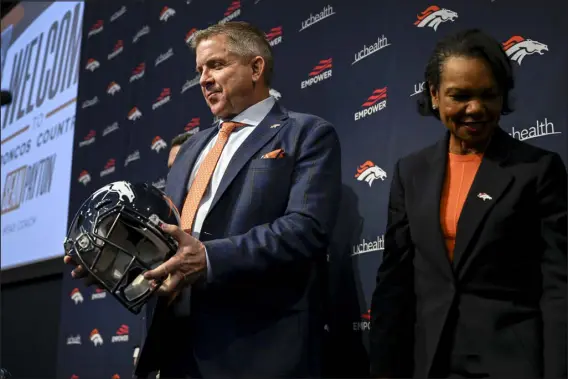  ?? AARON ONTIVEROZ — THE DENVER POST ?? Denver Broncos head coach Sean Payton stands with limited shareholde­r Condoleezz­a Rice during an introducto­ry news conference at team headquarte­rs earlier this month.
