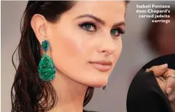  ??  ?? Isabeli Fontana dons Chopard’s carved jadeite earrings
