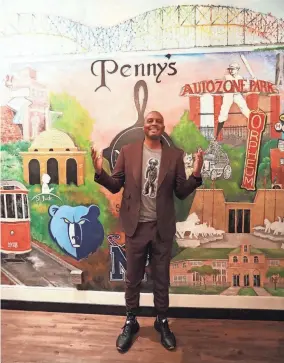  ?? STU BOYD II-THE COMMERCIAL APPEAL ?? Penny Hardaway poses in front of a Memphis-themed mural at his new restaurant Penny’s Nitty Gritty on Wednesday in Memphis.